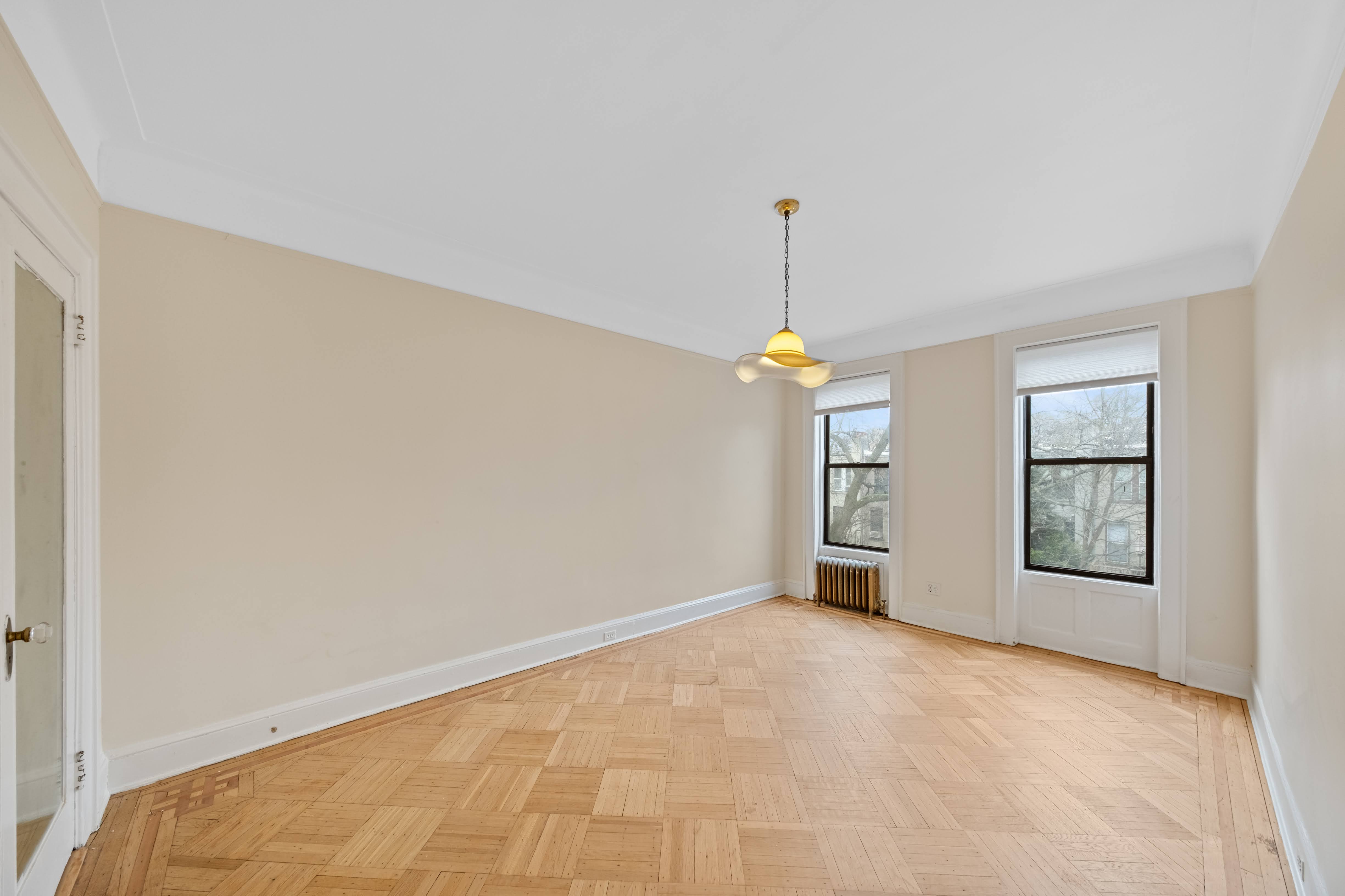 196 Maple Street Brooklyn, NY 11225 - Photo 11 of 31 a view of an empty room with a window