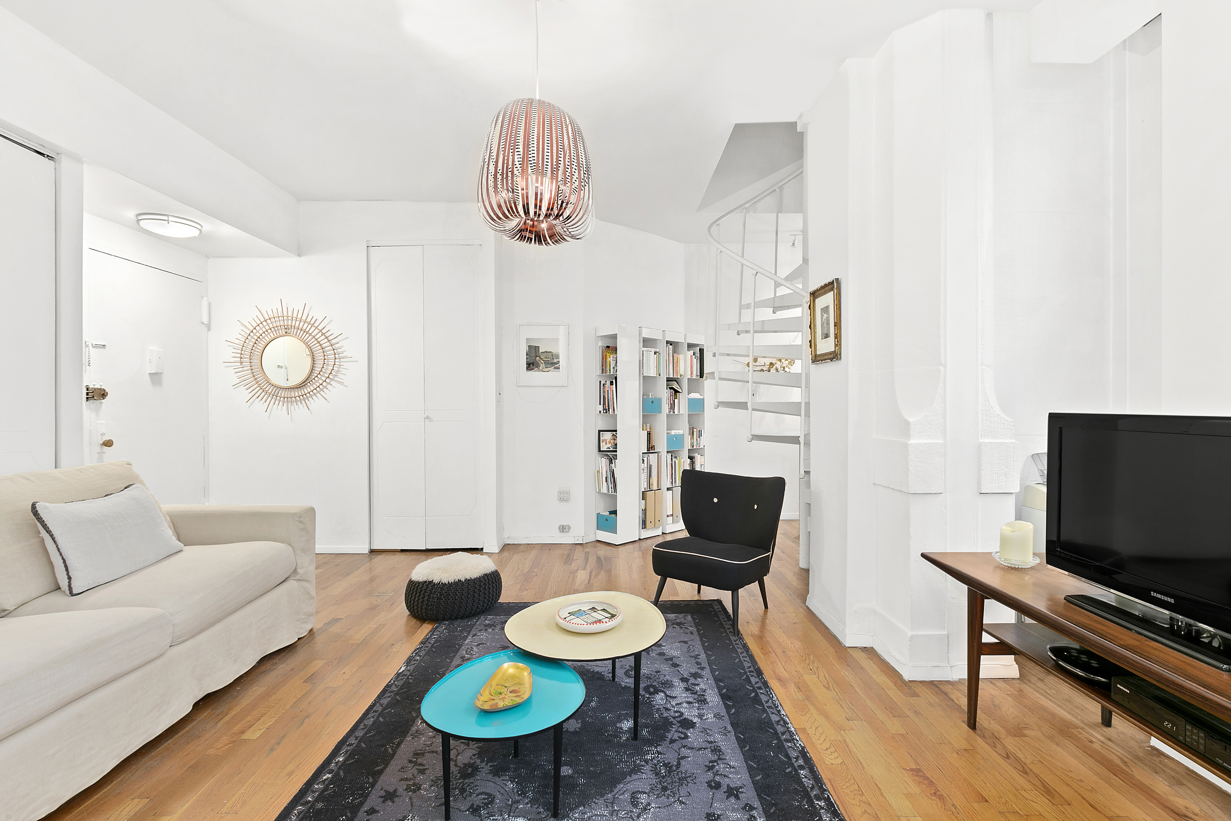 4 Lexington Avenue, Unit 8F Manhattan, NY 10010 - Photo 2 of 7 a living room with furniture and a flat screen tv