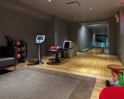 a room with gym equipment and a table