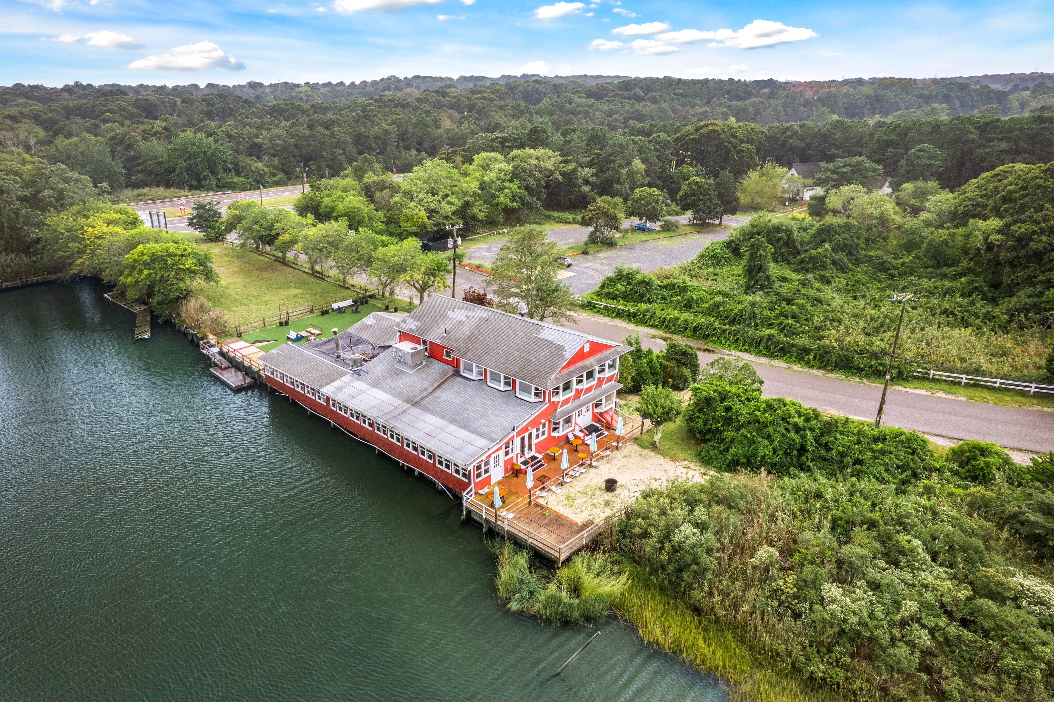 5 Inlet Road Hampton Bays, NY 11946 - Photo 3 of 20 a view of a lake with a mountain