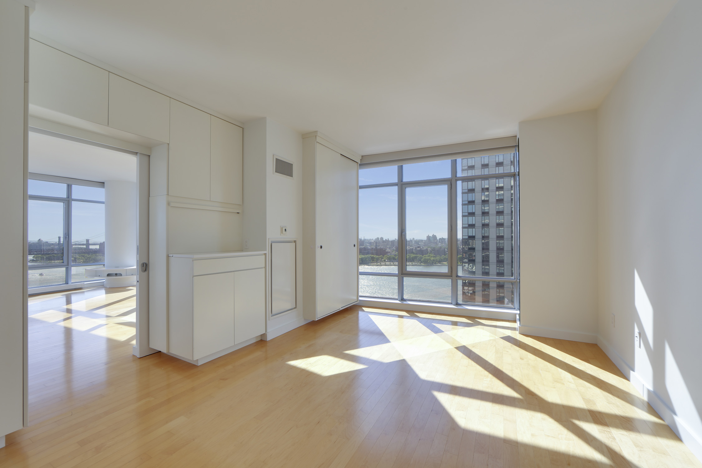1 Northside Piers, Unit 25D Brooklyn, NY 11249 - Photo 8 of 19 a view of empty room with floor to ceiling window