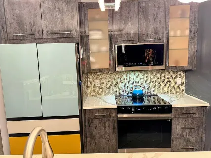 a bathroom with a sink a stove and a microwave