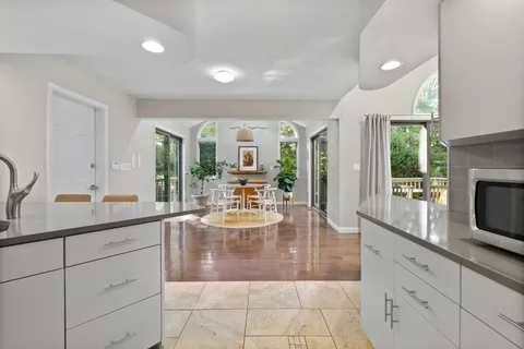 a kitchen with sink and cabinets