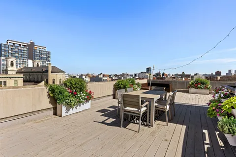 a view of a chairs and table in patio