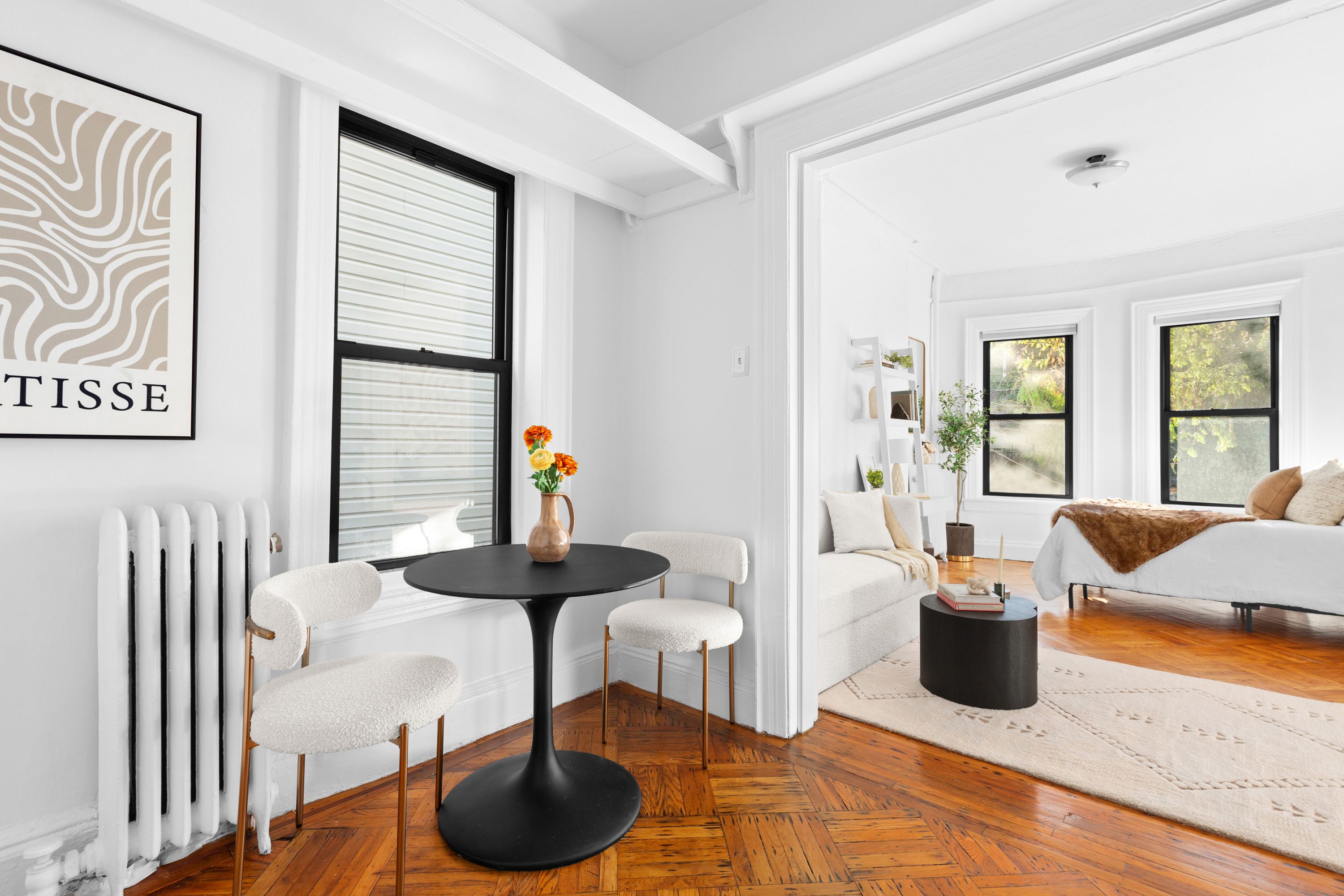 47 Reeve Place, Unit 1 Brooklyn, NY 11218 - Photo 2 of 8 a living room with furniture and a potted plant