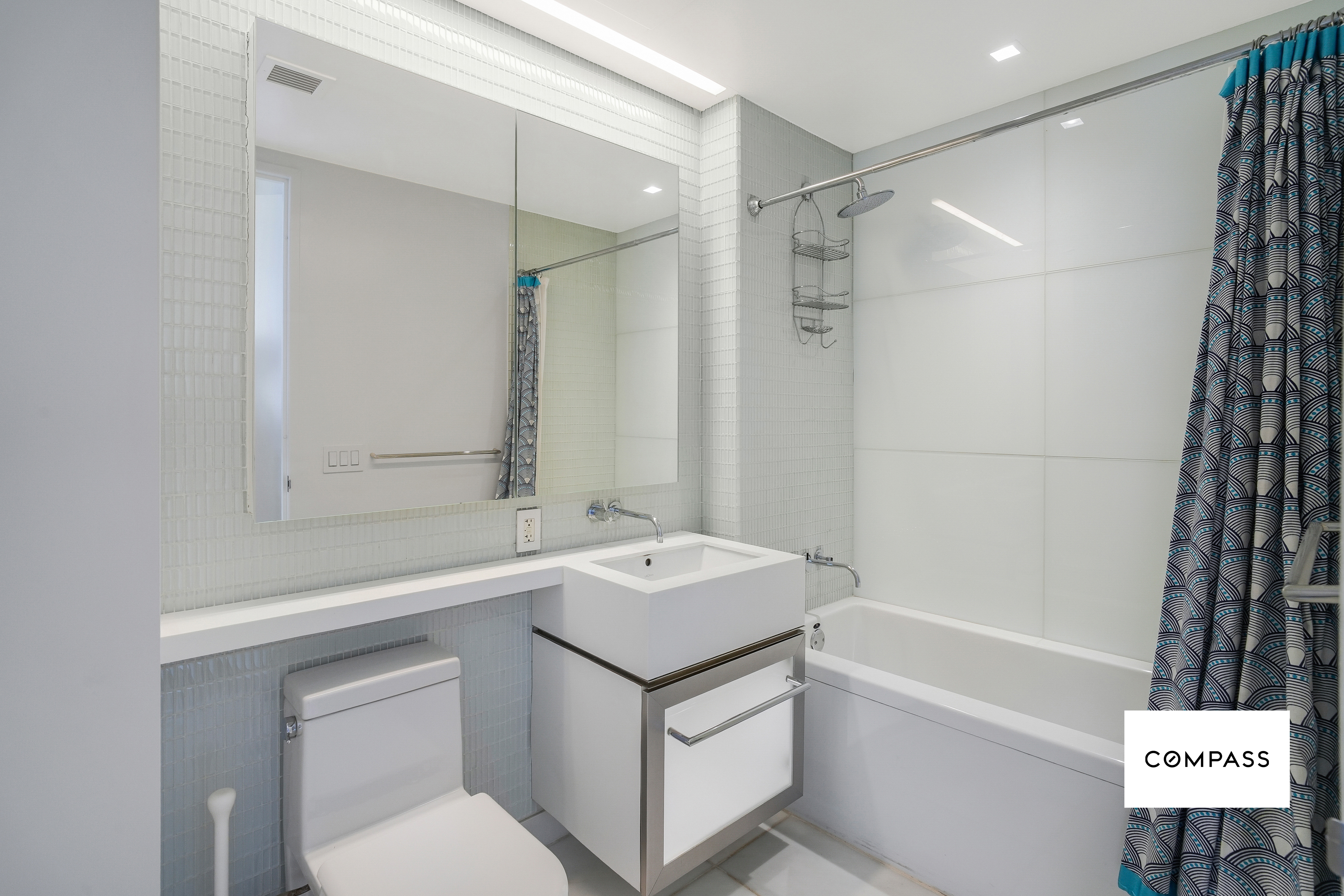400 East 67th Street, Unit 7B Manhattan, NY 10065 - Photo 6 of 14 a bathroom with a sink toilet and shower
