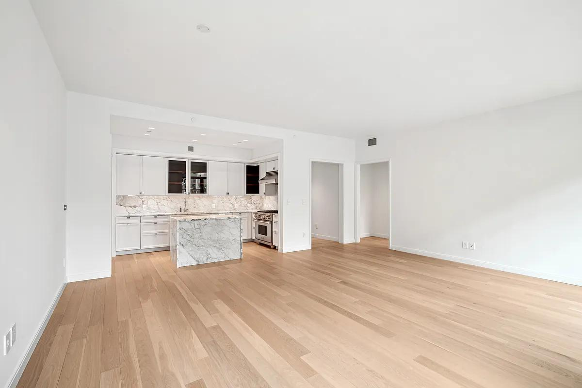 269 West 87th Street, Unit 7B Manhattan, NY 10024 - Photo 2 of 21 a large white bed in a white room