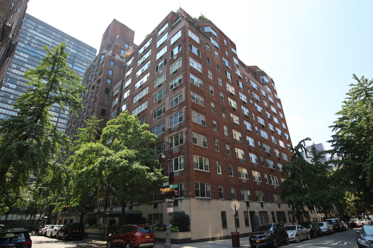 12 Beekman Place, Unit 7/8B Manhattan, NY 10022 - Photo 15 of 17 a view of a tall building next to a road