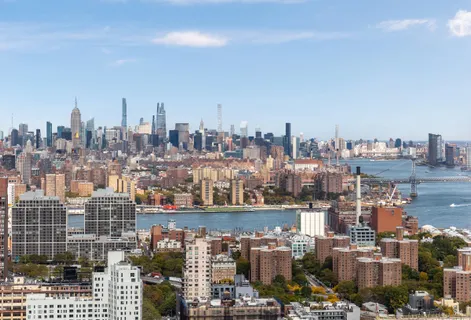 a view of a city with tall buildings