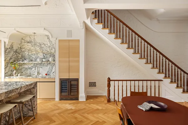 a balcony view with a seating space