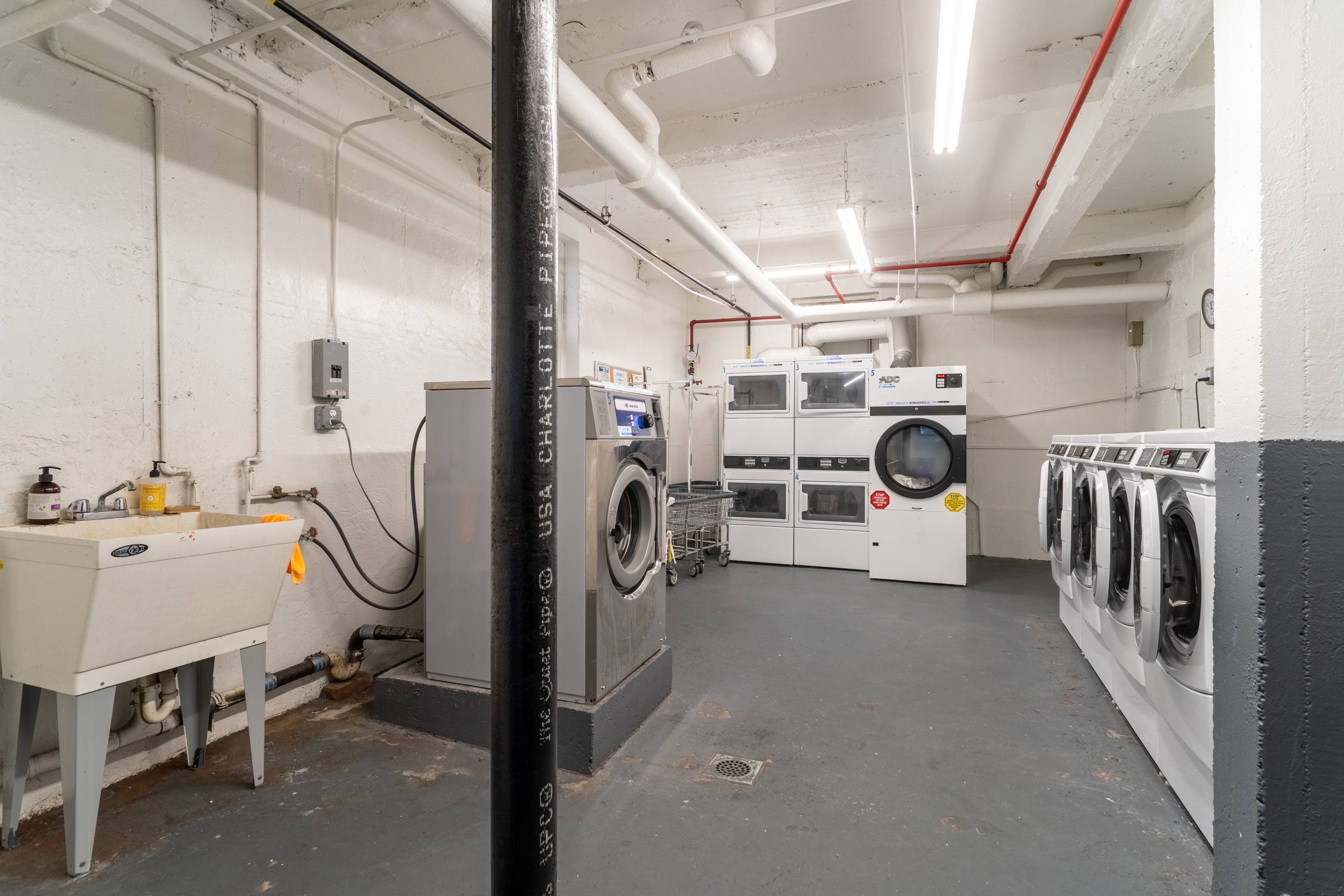 143 Bennett Avenue, Unit 6R Manhattan, NY 10040 - Photo 16 of 22 a view of a storage & utility room with washer and dryer