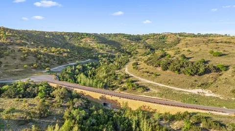 a view of a large body of water with a building in the background