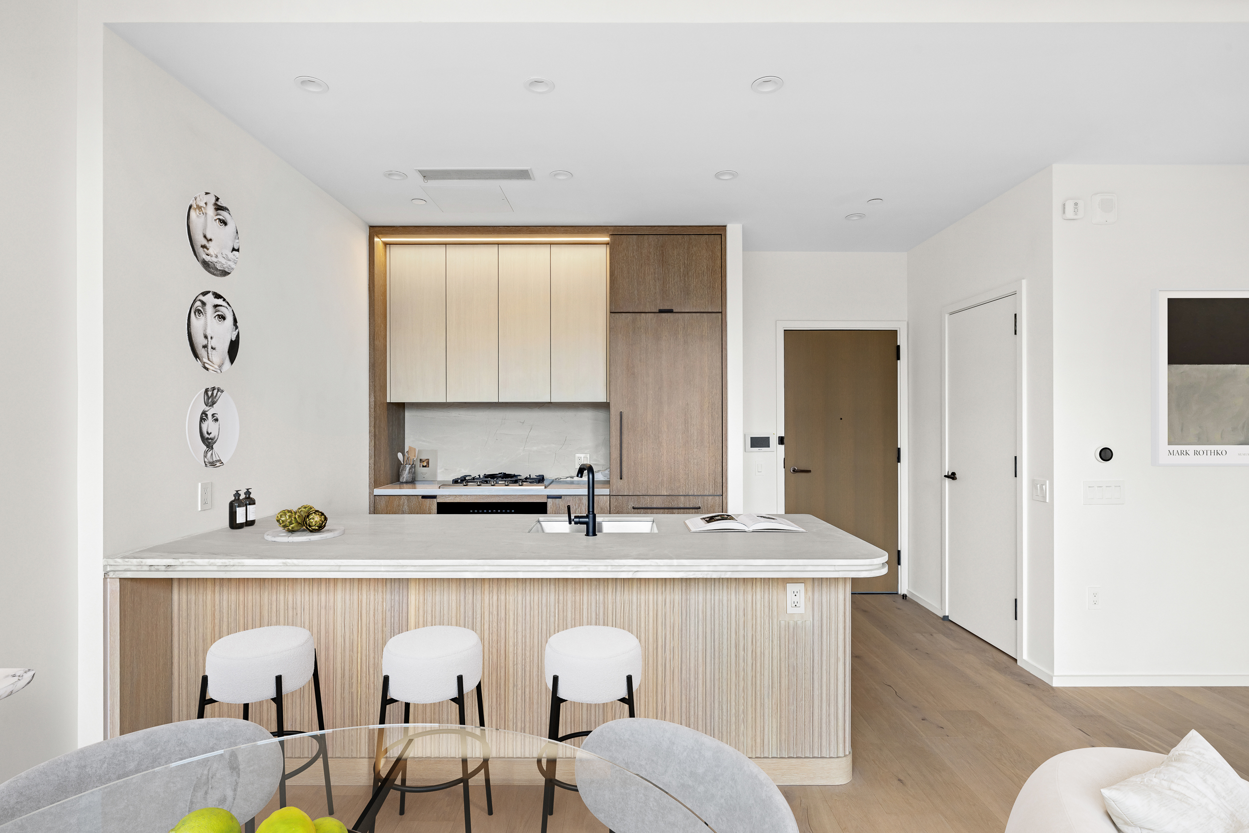 249 East 62nd Street, Unit 10B Manhattan, NY 10065 - Photo 2 of 21 a living room with furniture a sink and a window