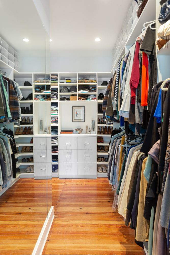 685 East 22nd Street Brooklyn, NY 11210 - Photo 19 of 43 a view of walk in closet with clothes and shoes