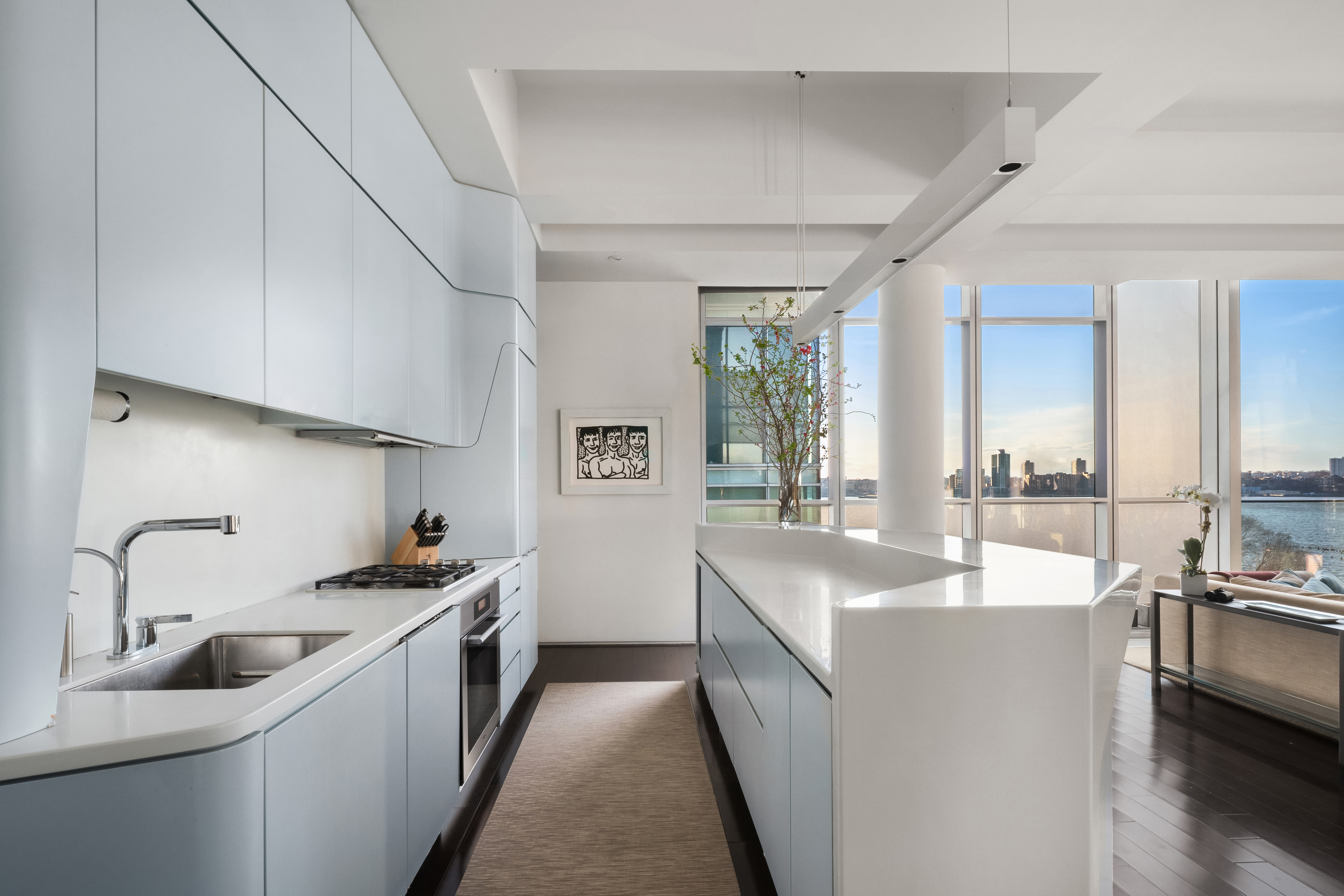 166 Perry Street, Unit 6A Manhattan, NY 10014 - Photo 5 of 20 a kitchen with sink a stove and cabinets