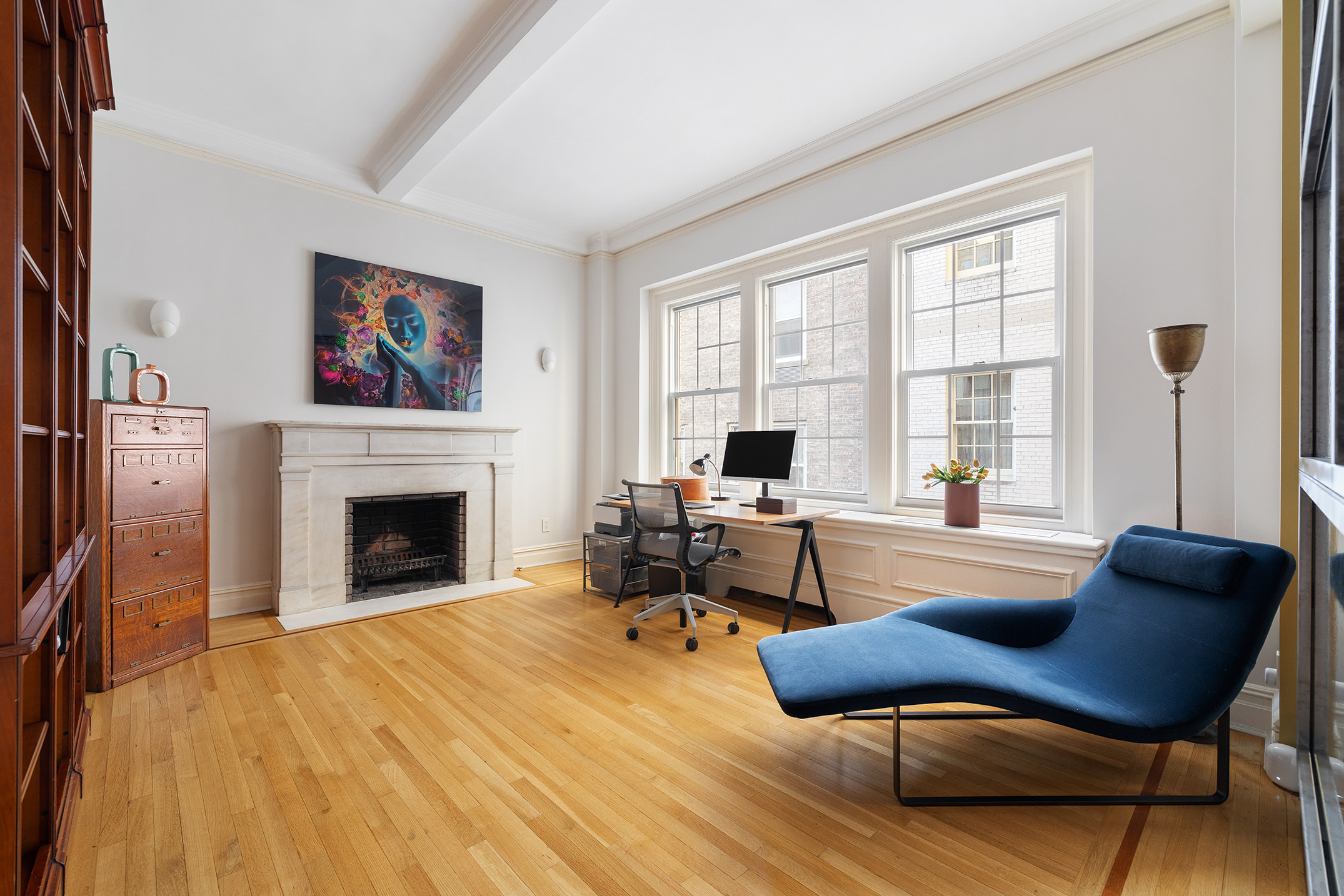 829 Park Avenue, Unit 2/3D Manhattan, NY 10021 - Photo 9 of 18 a living room with furniture and a fireplace