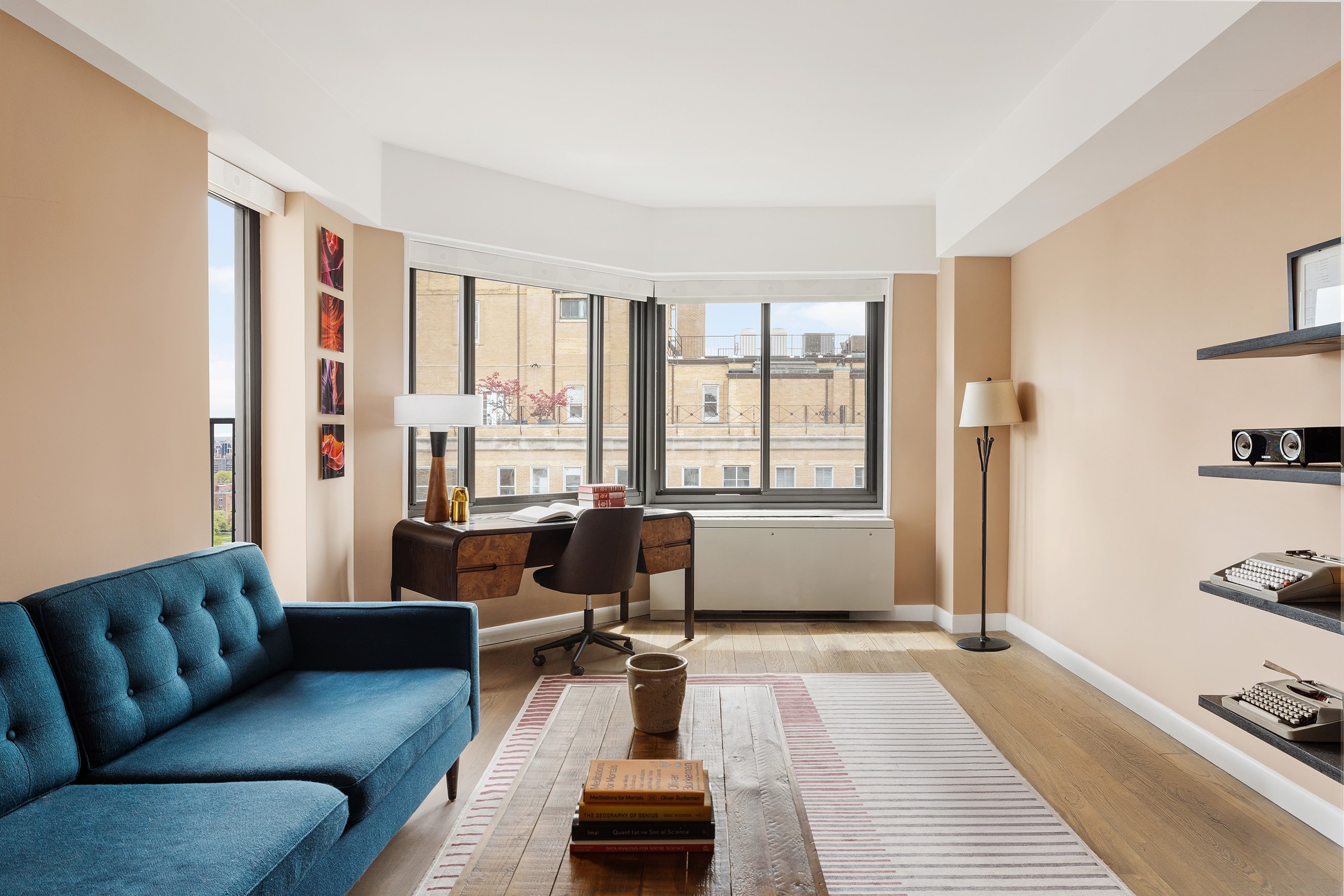 10 East End Avenue, Unit 18D Manhattan, NY 10075 - Photo 11 of 21 a living room with furniture and a window