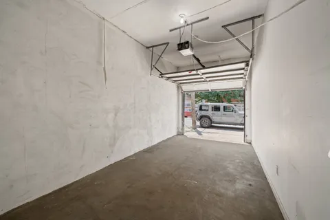 a view of hallway with furniture