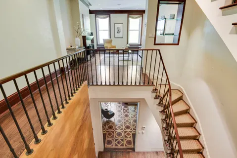 a view of entryway with wooden floor and door