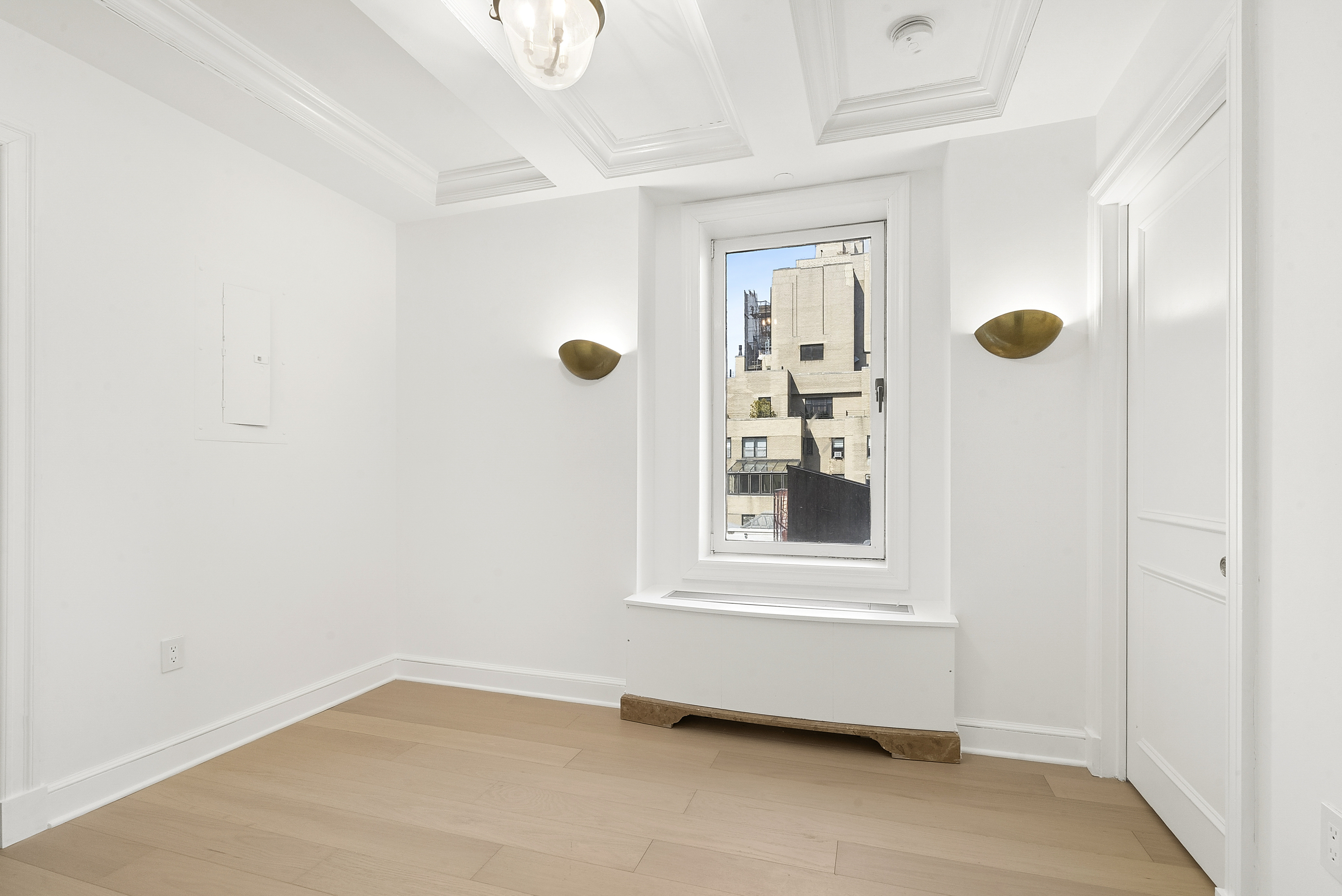 15 East 69th Street, Unit 10D Manhattan, NY 10021 - Photo 10 of 12 an empty room with windows