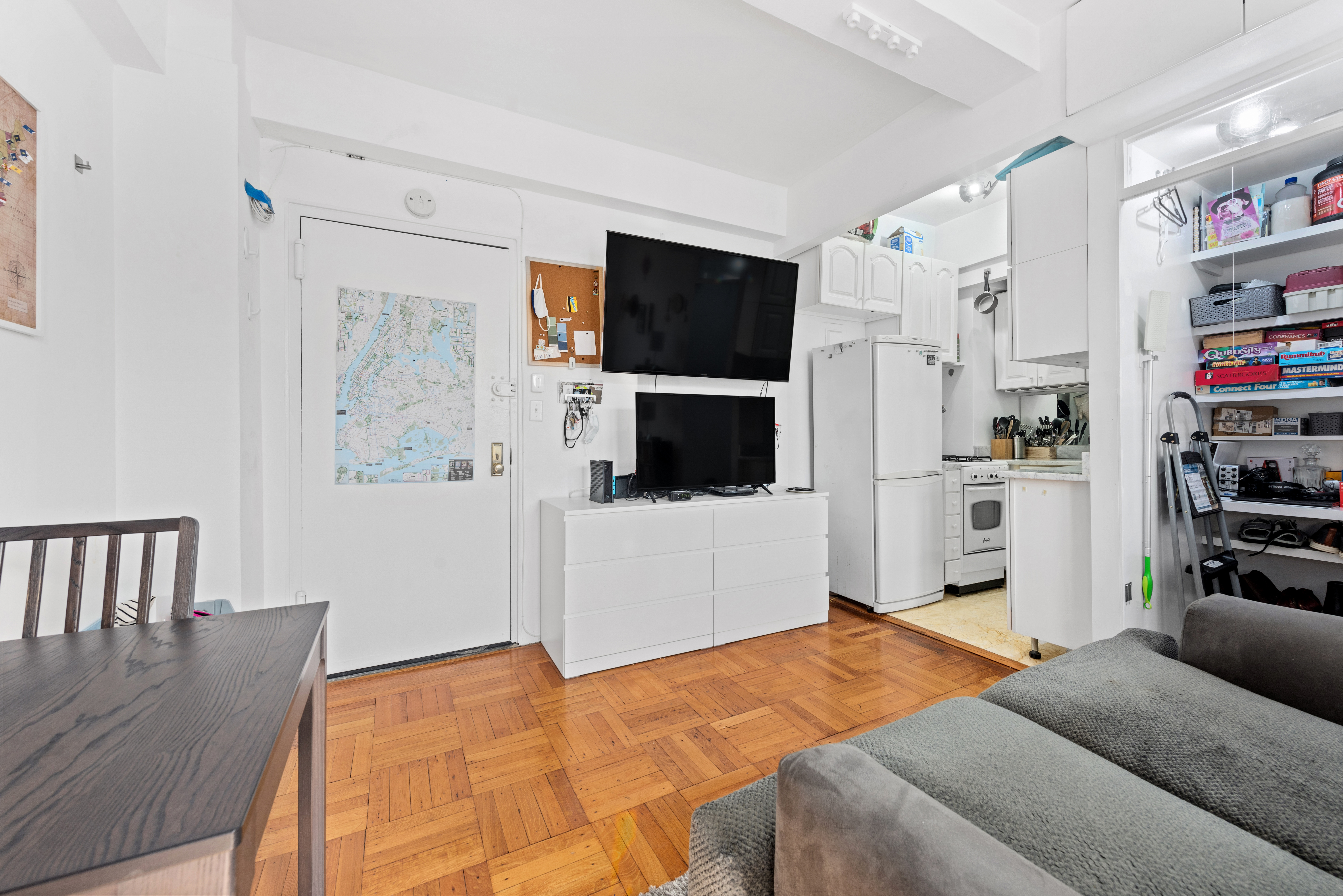 225 Central Park West, Unit 619 Manhattan, NY 10024 - Photo 2 of 6 a bedroom with a bed and a flat screen tv