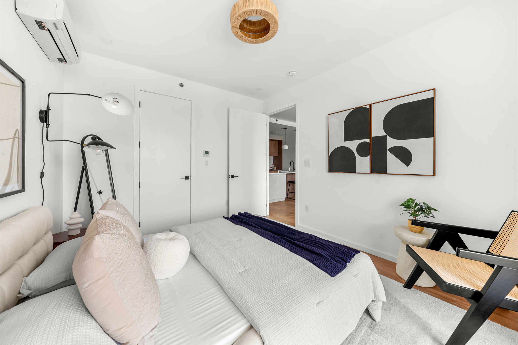 14-35 Broadway, Unit 2B Queens, NY 11106 - Photo 6 of 10 a bedroom with a bed and furniture