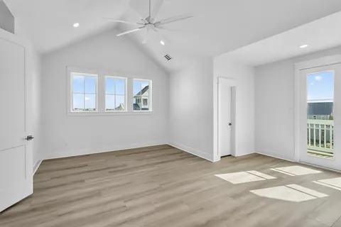 a view of an entryway with wooden floor