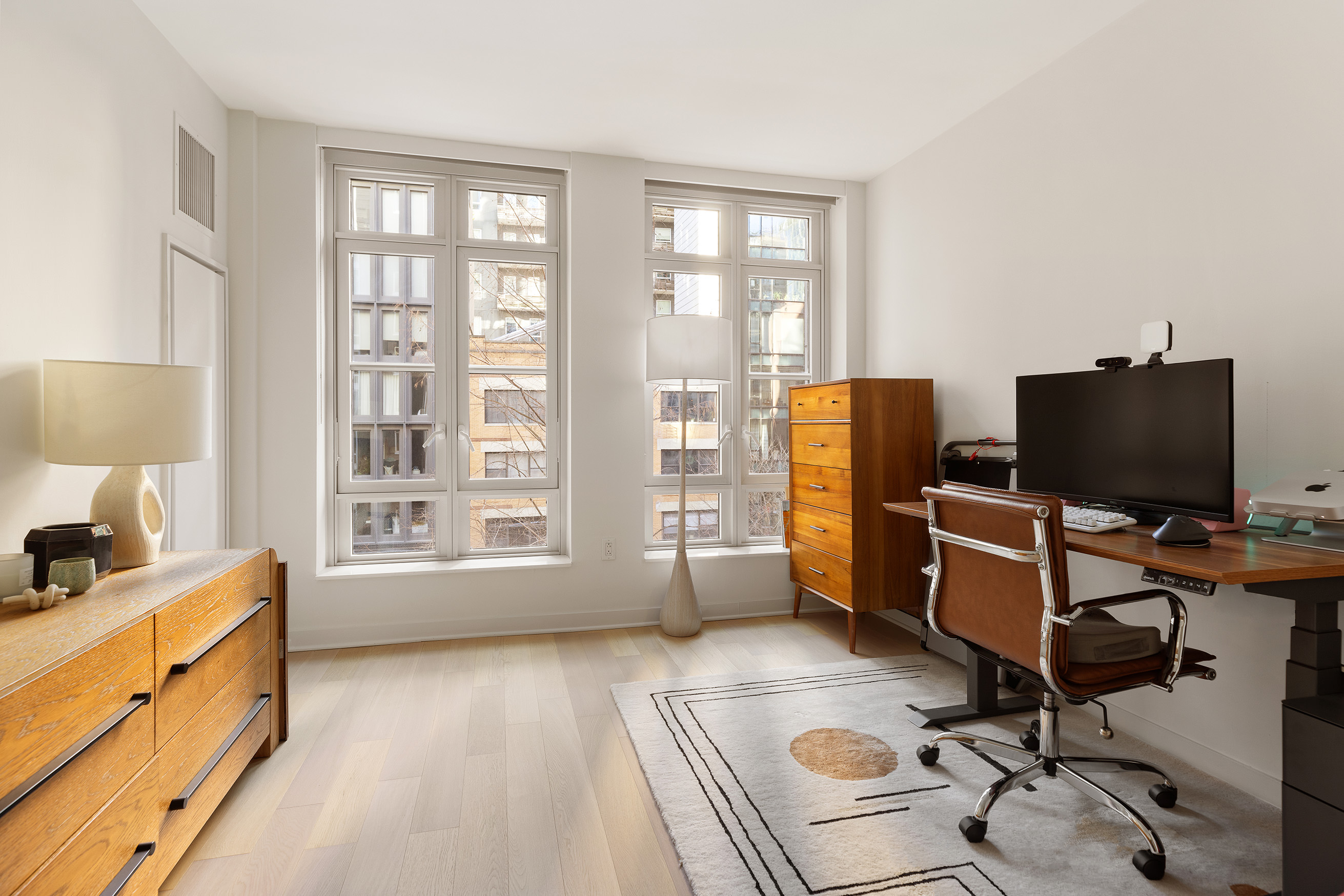 261 Hudson Street, Unit 5S Manhattan, NY 10013 - Photo 3 of 6 a view of workspace with wooden floor windows