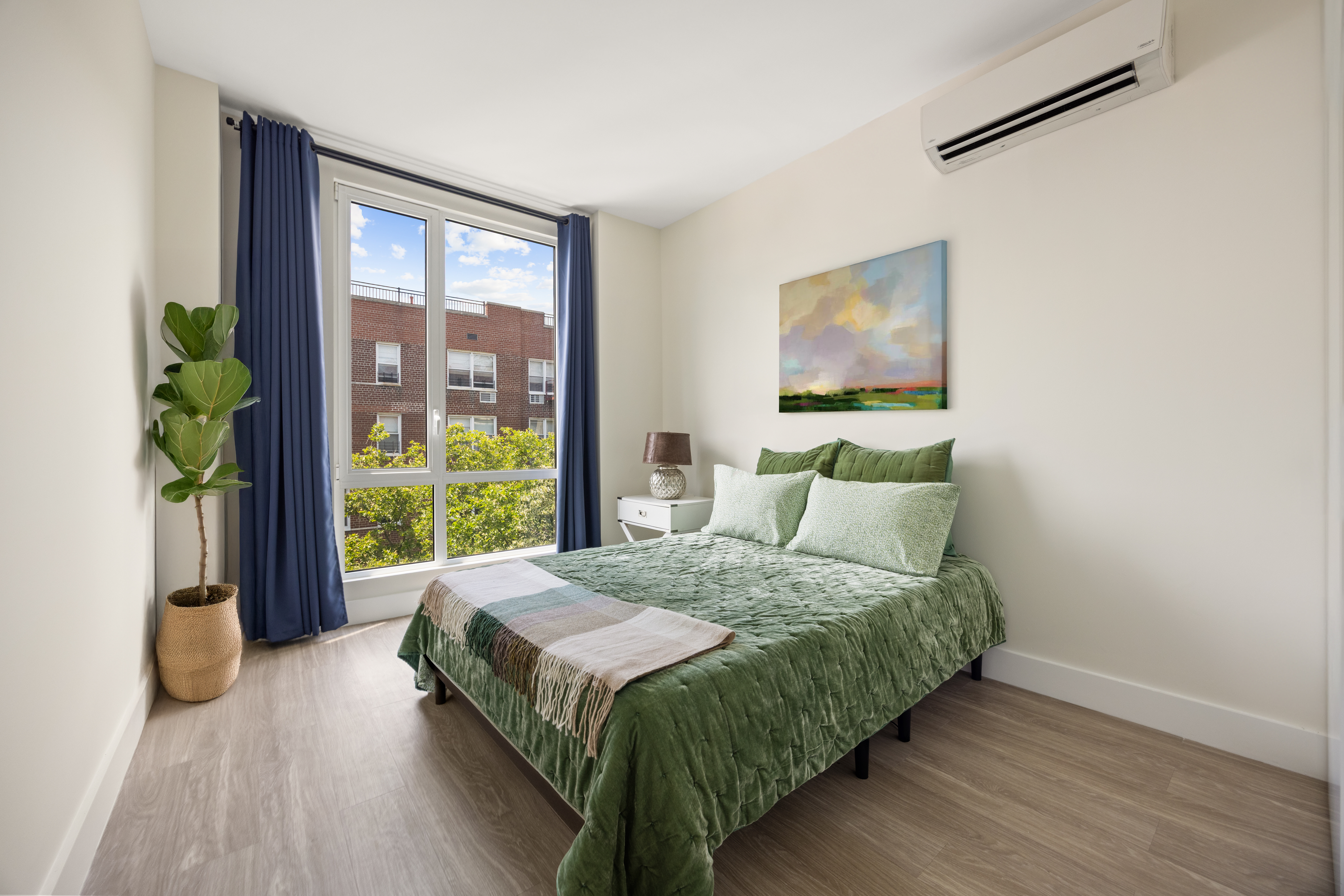 631 East 18th Street, Unit 5C Brooklyn, NY 11226 - Photo 5 of 8 a bedroom with a bed and a window