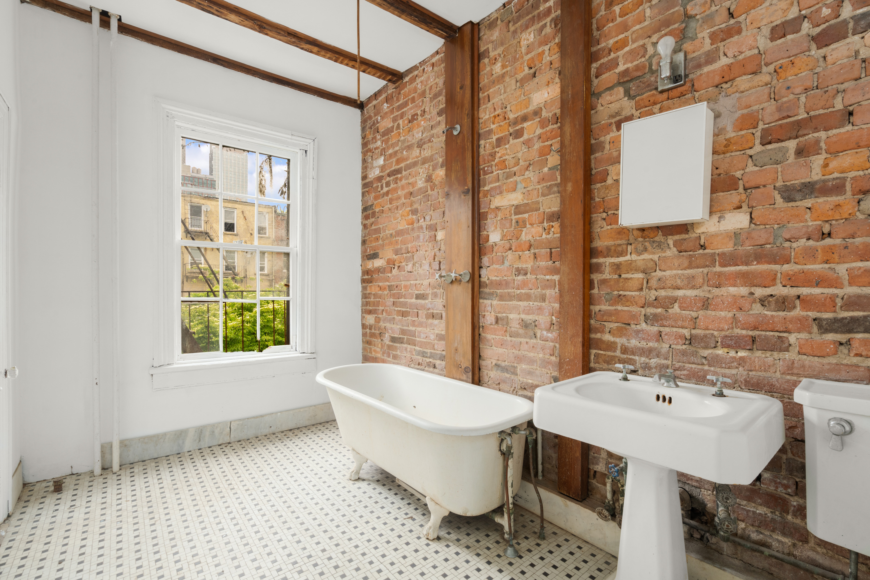 217 Dean Street Brooklyn, NY 11217 - Photo 14 of 26 a bathroom with a sink toilet and mirror