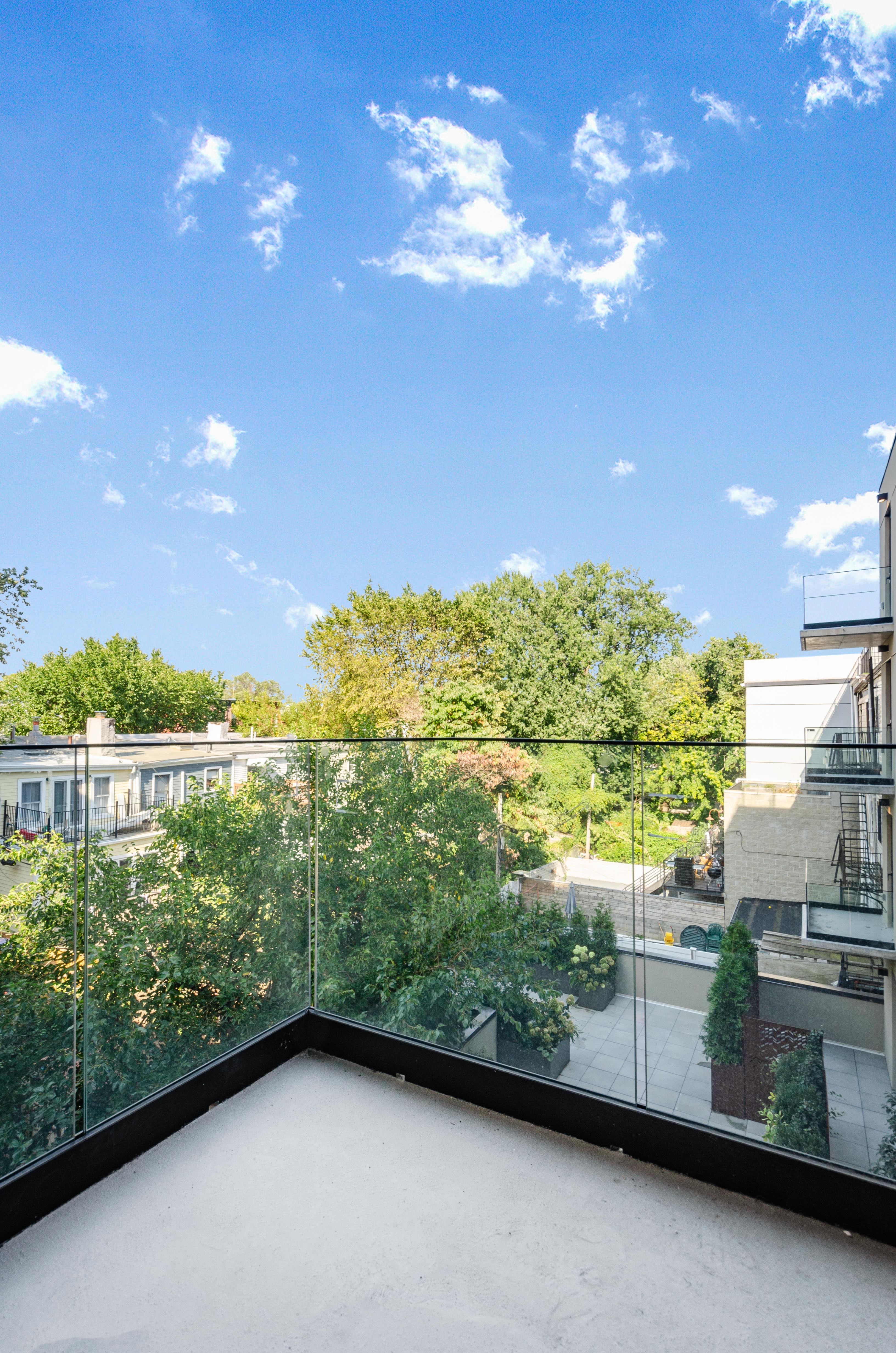 435 Tompkins Avenue, Unit 304S Brooklyn, NY 11216 - Photo 8 of 15 a backyard of a house with a yard and outdoor seating