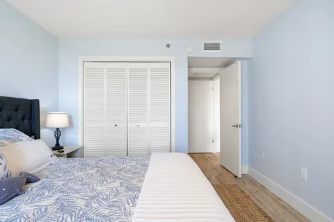 a bedroom with a bed and a toilet