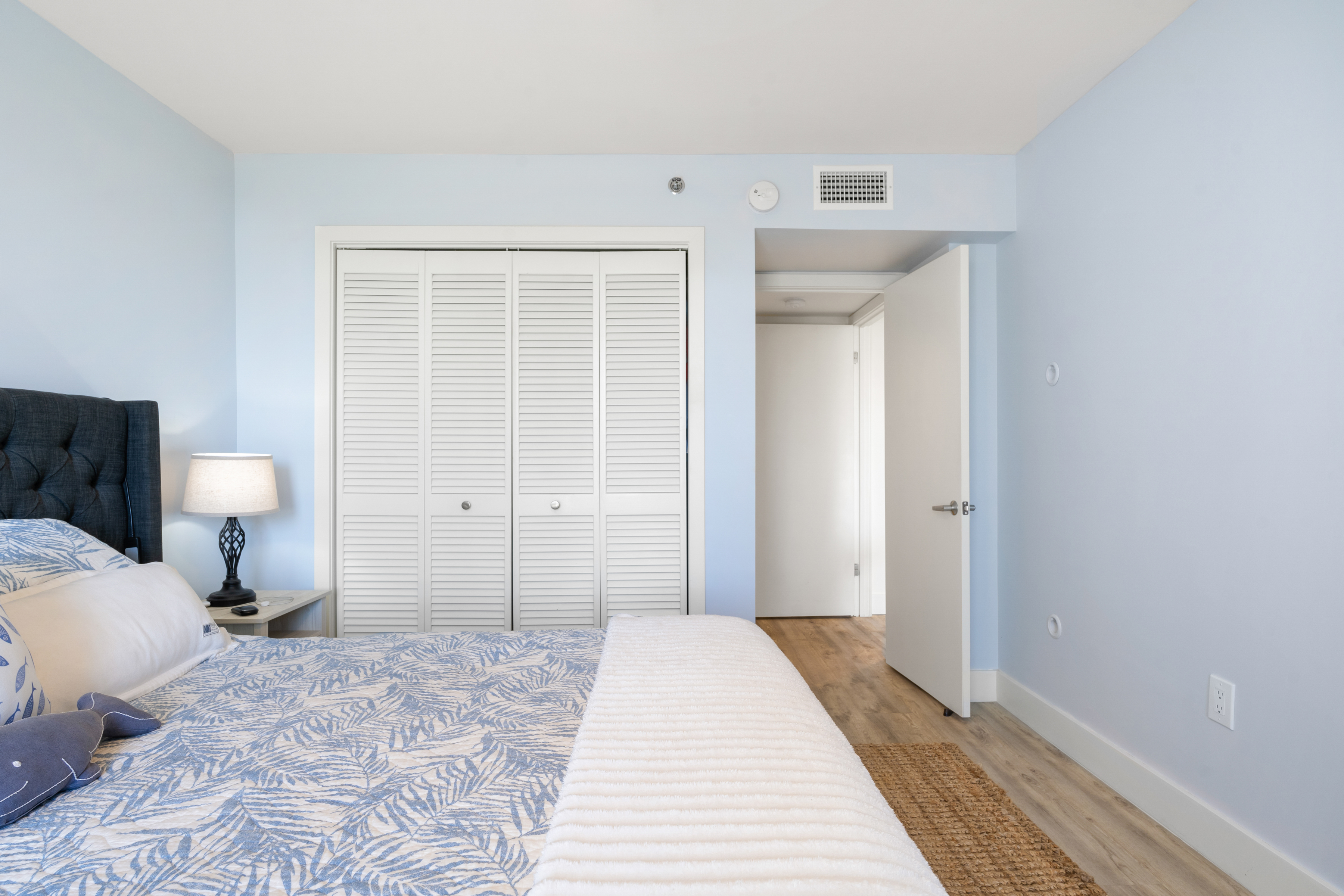 2700 North Highway A1a, Unit 207 Fort Pierce, FL 34949 - Photo 23 of 36 a bedroom with a bed and a toilet