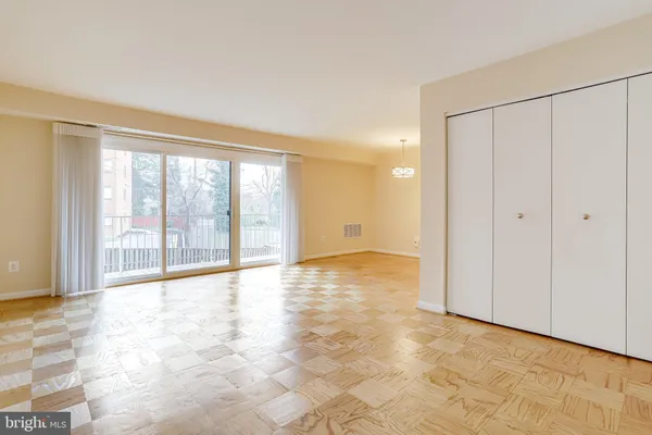 a view of a dining room with furniture wooden floor and a chandelier