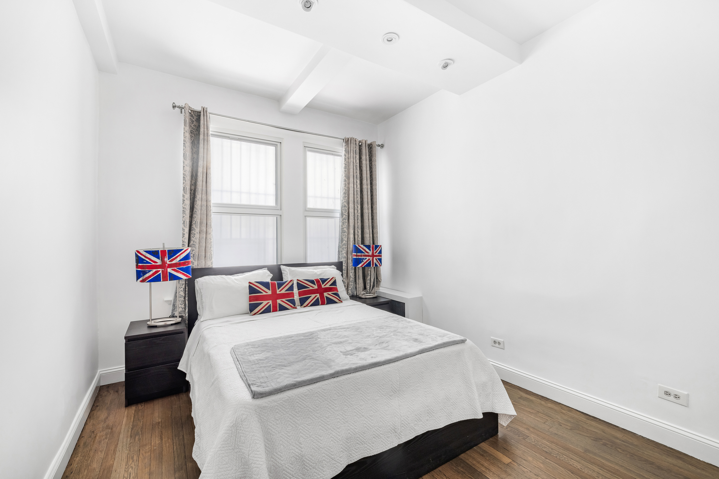 66 Madison Avenue, Unit 1D Manhattan, NY 10016 - Photo 4 of 6 a bedroom with a bed and a window