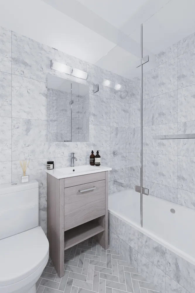 a bathroom with a sink a toilet and bathtub