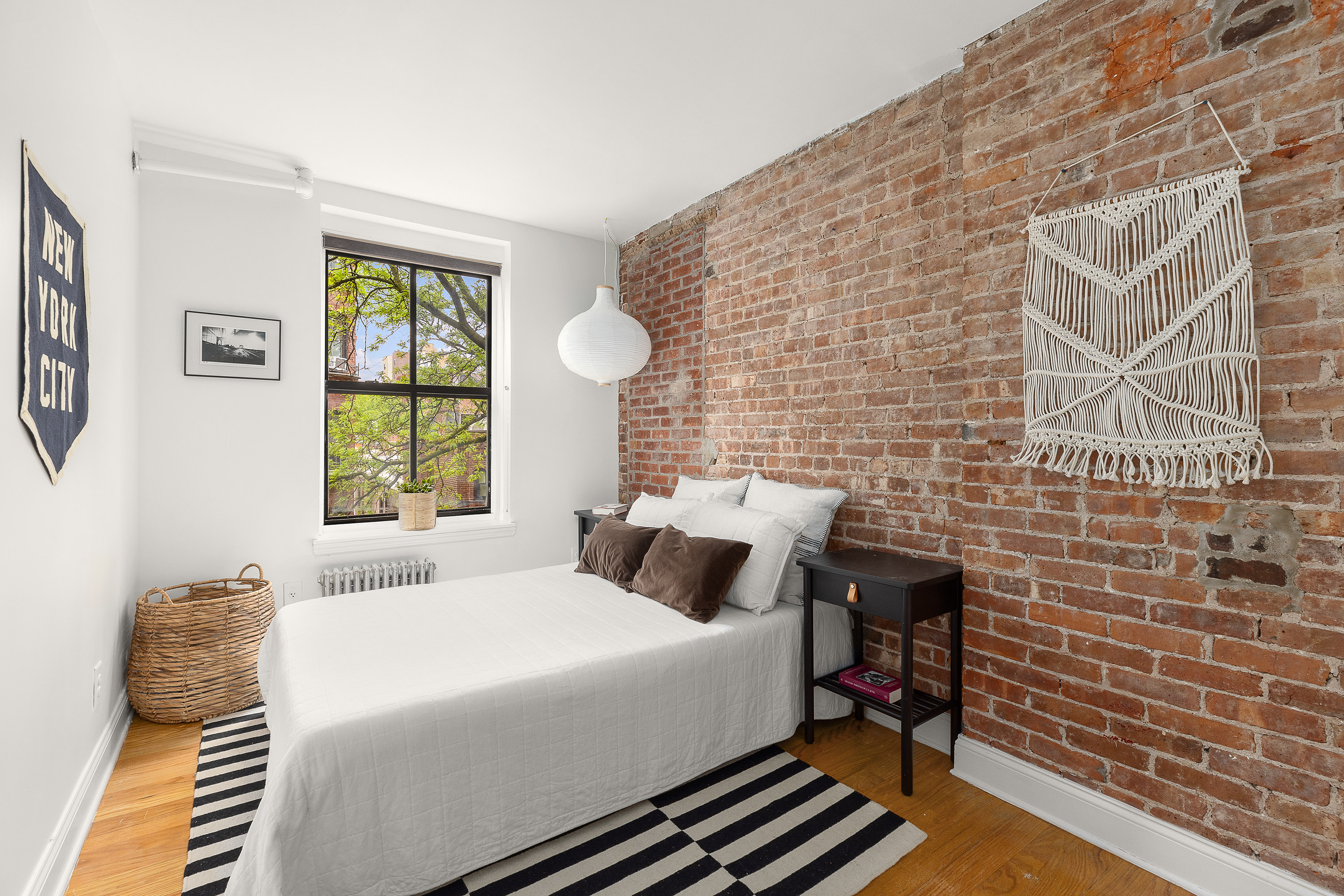 138 Baltic Street, Unit 4C Brooklyn, NY 11201 - Photo 10 of 12 a bedroom with a bed and a wall painting