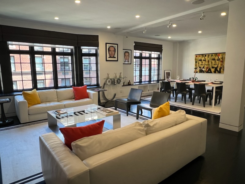 40 East 62nd Street, Unit 8E Manhattan, NY 10065 - Photo 11 of 24 a living room with furniture and large window