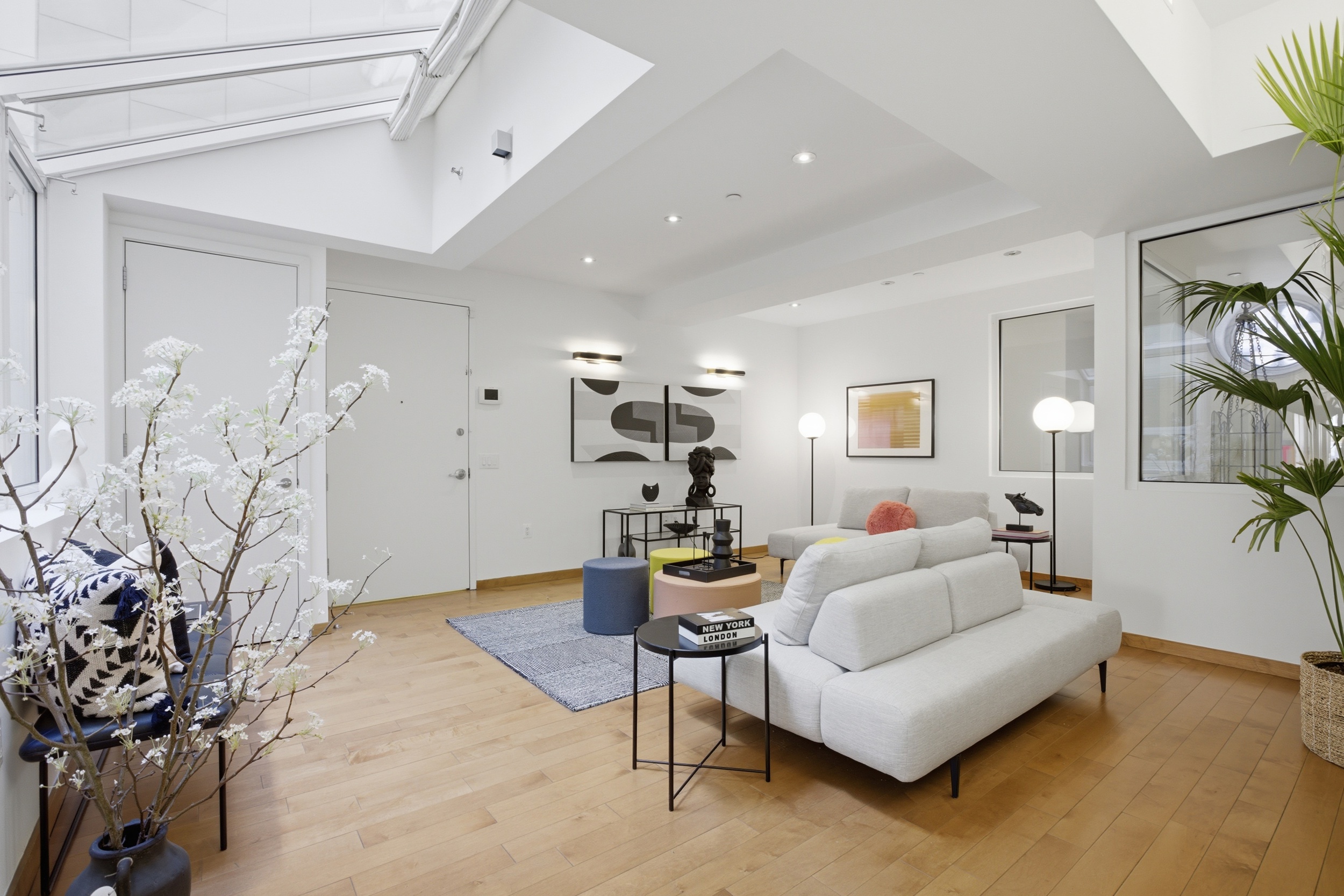 135 West 4th Street, Unit 2W Manhattan, NY 10012 - Photo 4 of 20 a living room with furniture and wooden floor