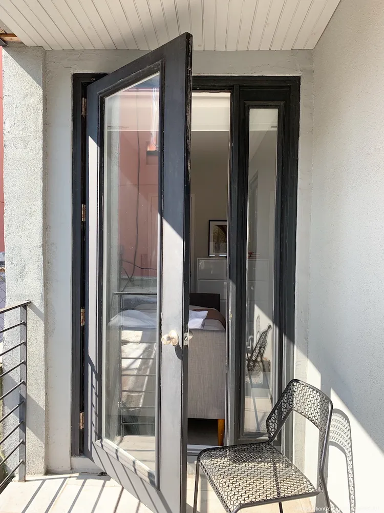 a bathroom with a sink vanity and shower