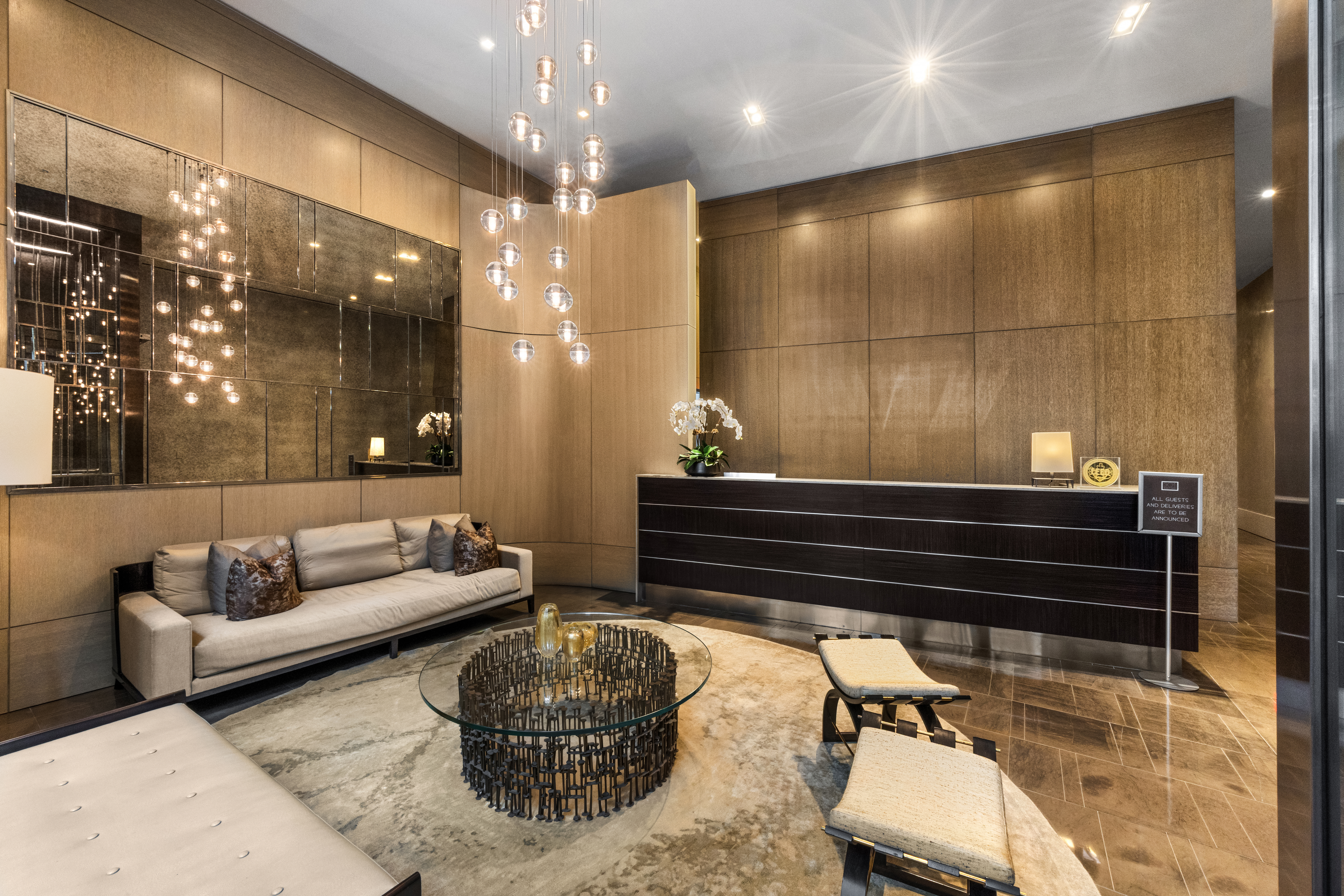 301 East 50th Street, Unit 8C Manhattan, NY 10022 - Photo 18 of 20 a living room with furniture and a chandelier