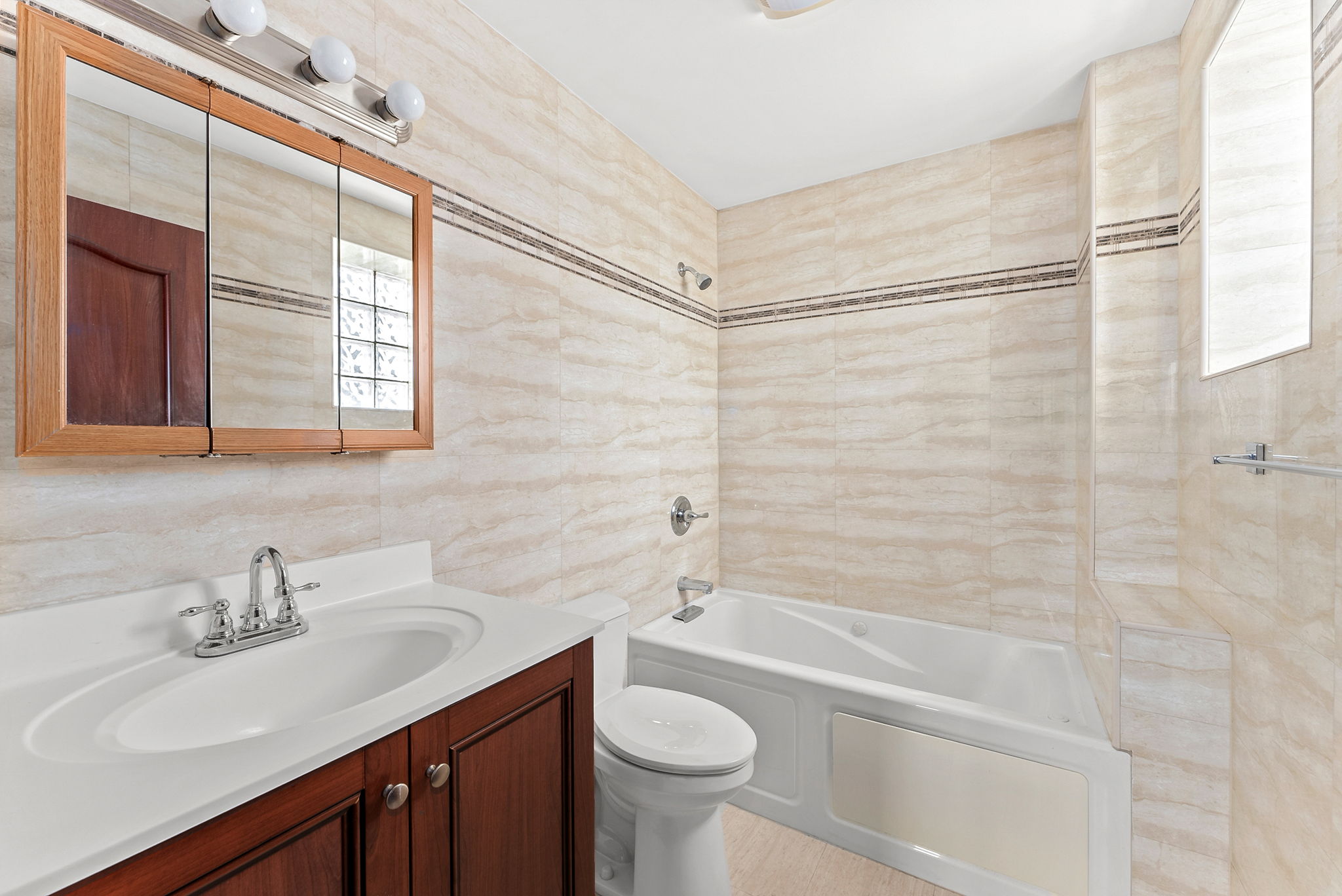 842 Ocean Parkway, Unit 8B Brooklyn, NY 11230 - Photo 12 of 14 a bathroom with a sink a toilet and shower
