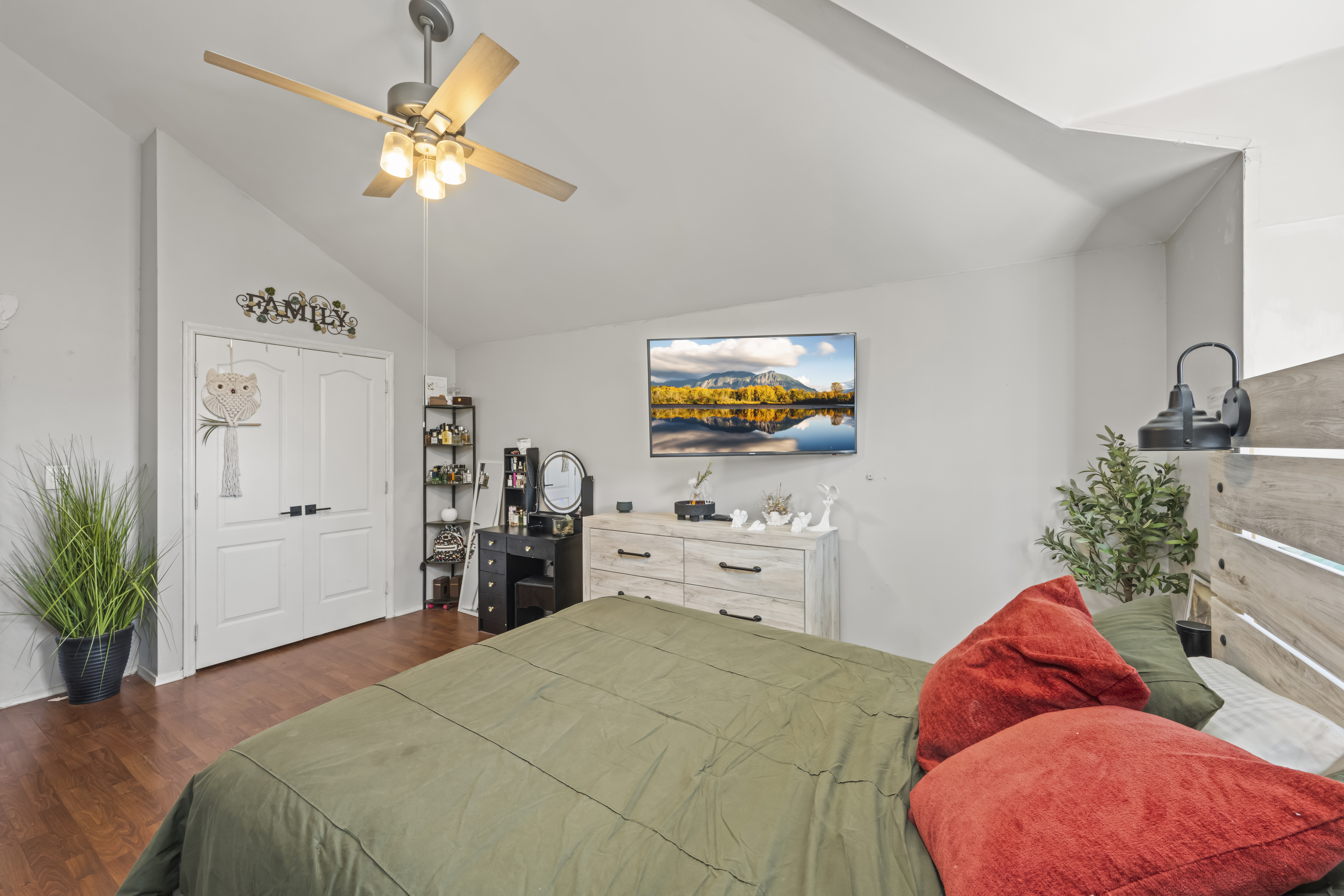 55 Sideview Avenue Staten Island, NY 10314 - Photo 12 of 28 a bedroom with a bed and a chandelier