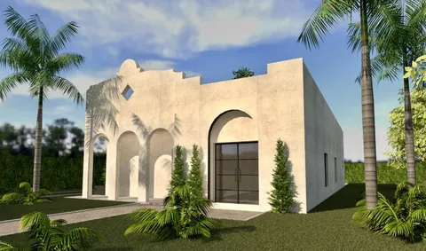 a front view of a house with a garden