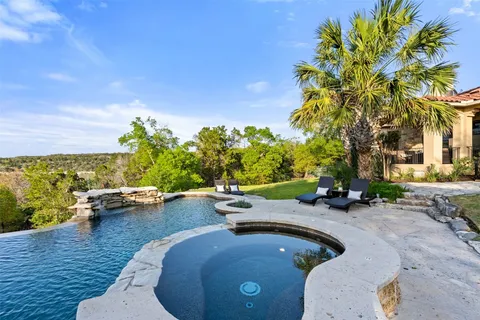 a living room with furniture fireplace and flat screen tv