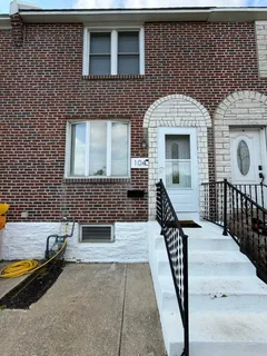 a front view of a house with stairs