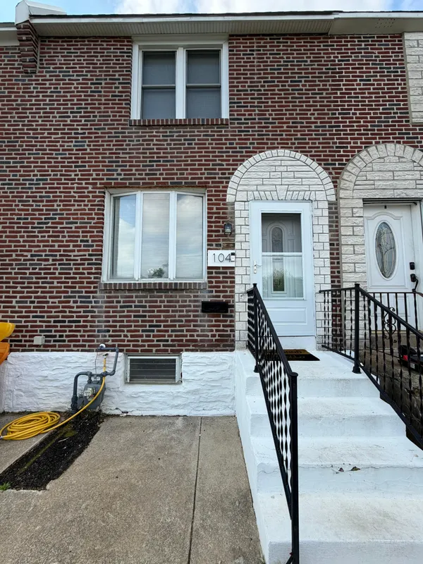 a front view of a house with stairs