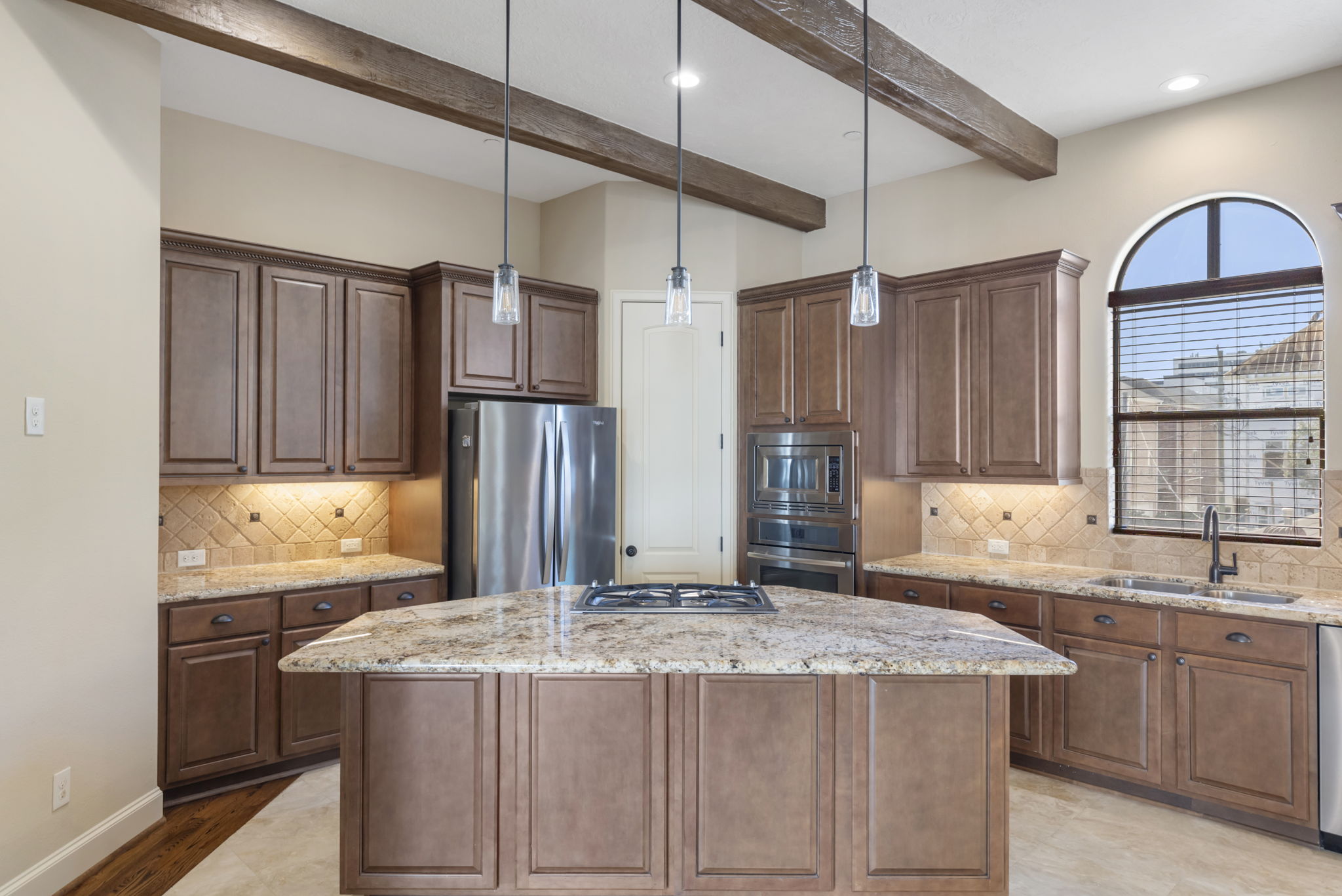 5407 Feagan Street Houston, TX 77007 - Photo 17 of 43 a kitchen with kitchen island granite countertop a sink stove and refrigerator