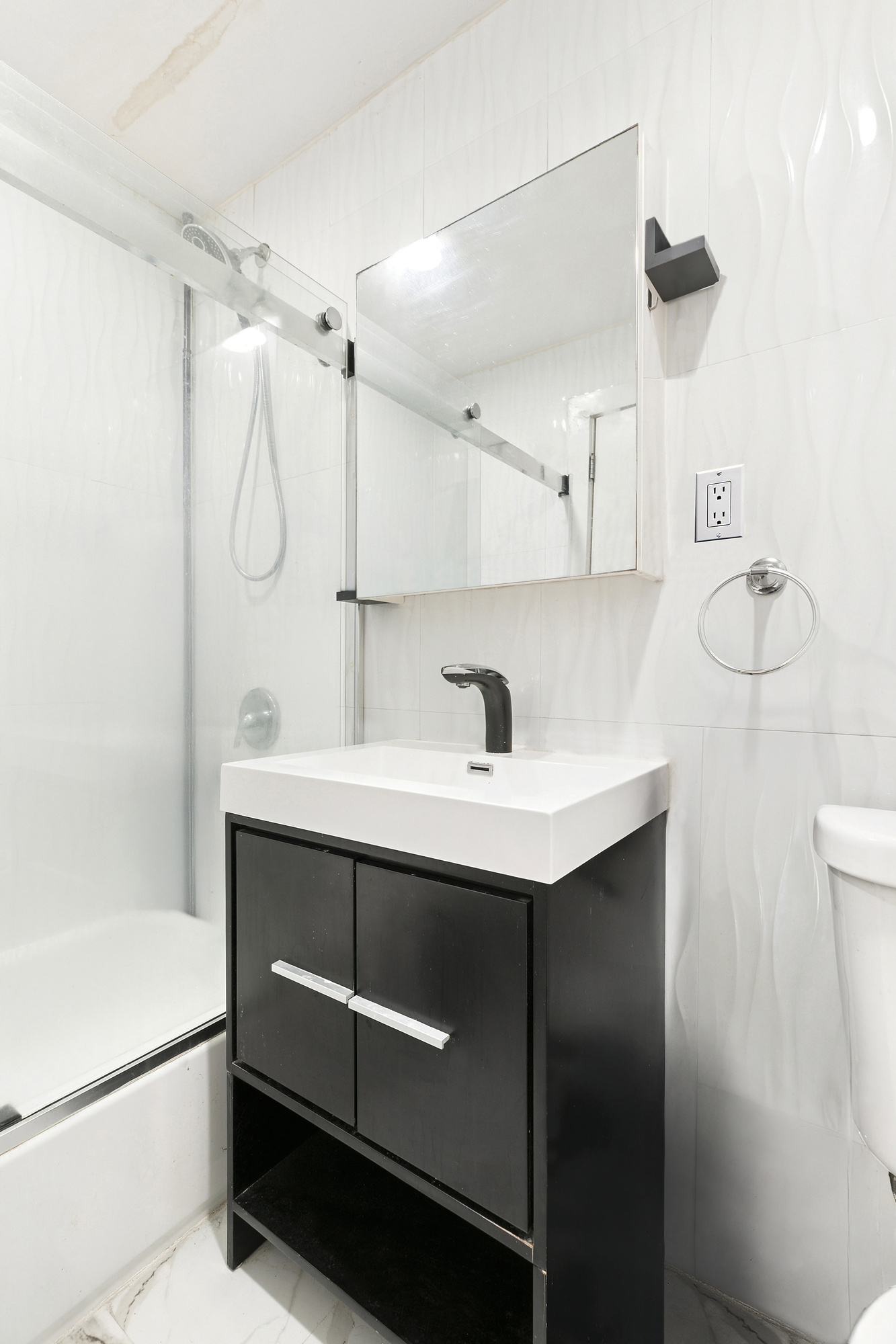 1273 Bushwick Avenue, Unit 2 Brooklyn, NY 11207 - Photo 8 of 9 a bathroom with a sink and mirror