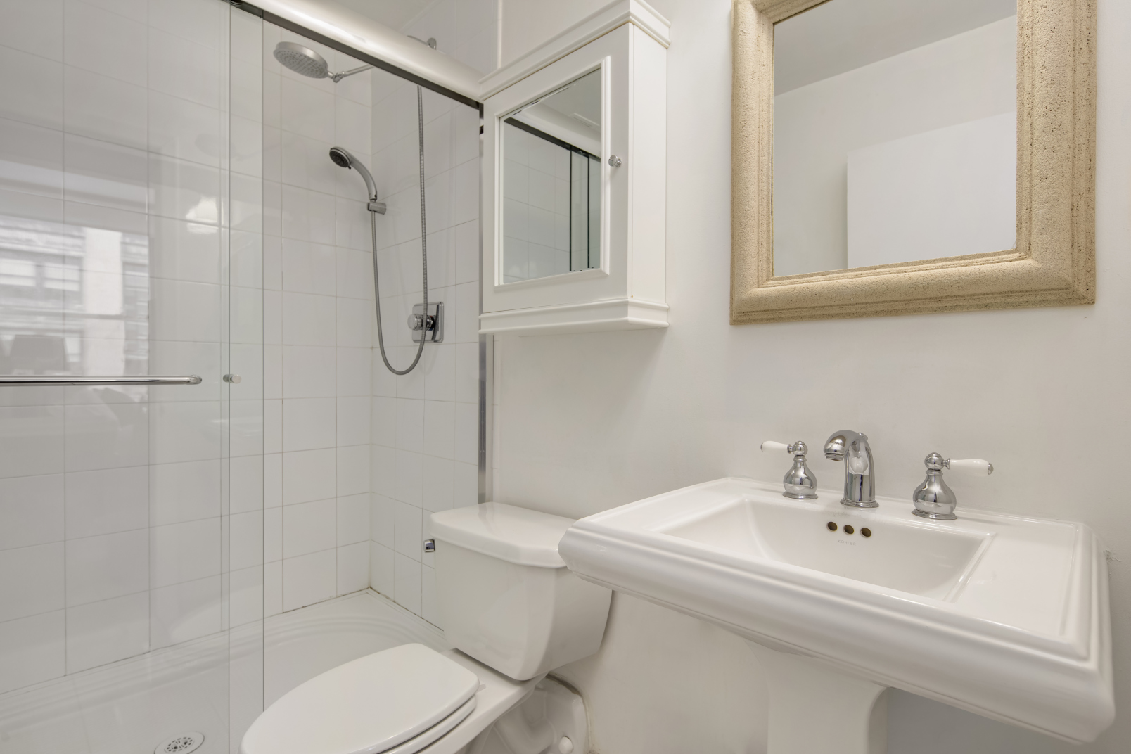 425 Park Avenue South, Unit 9B Manhattan, NY 10016 - Photo 5 of 7 a white toilet sitting next to a bathroom sink